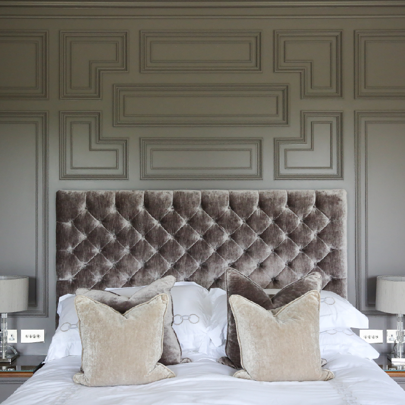 Geometric wall panelling in a bedroom